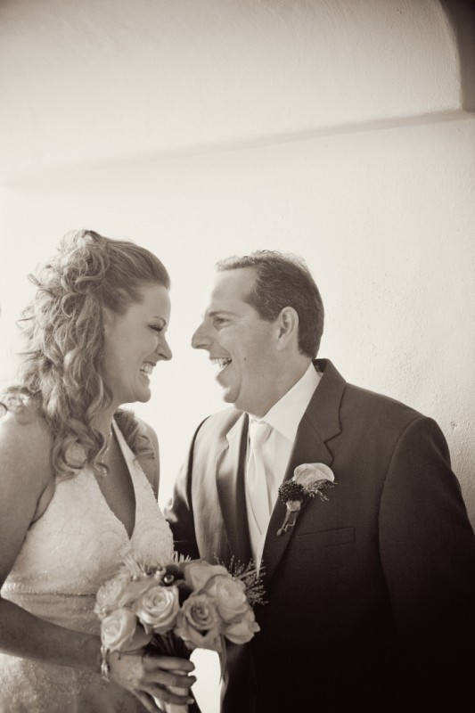 bride and groom laughing 